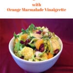shaved brussels sprouts salad with oranges and cranberries and text overlay