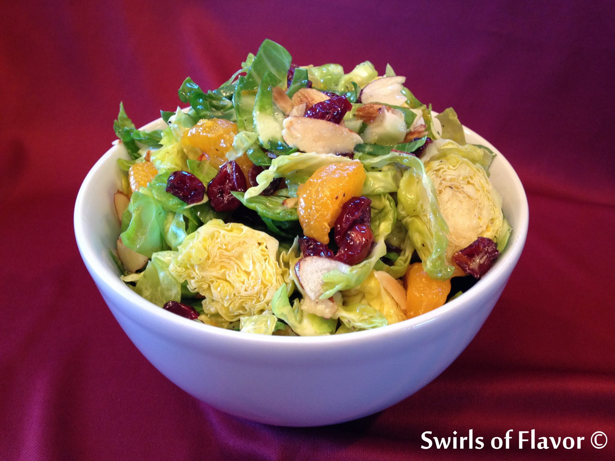 Shaved Brussel Sprouts Salad with Orange Marmalade Vinaigrette Swirls