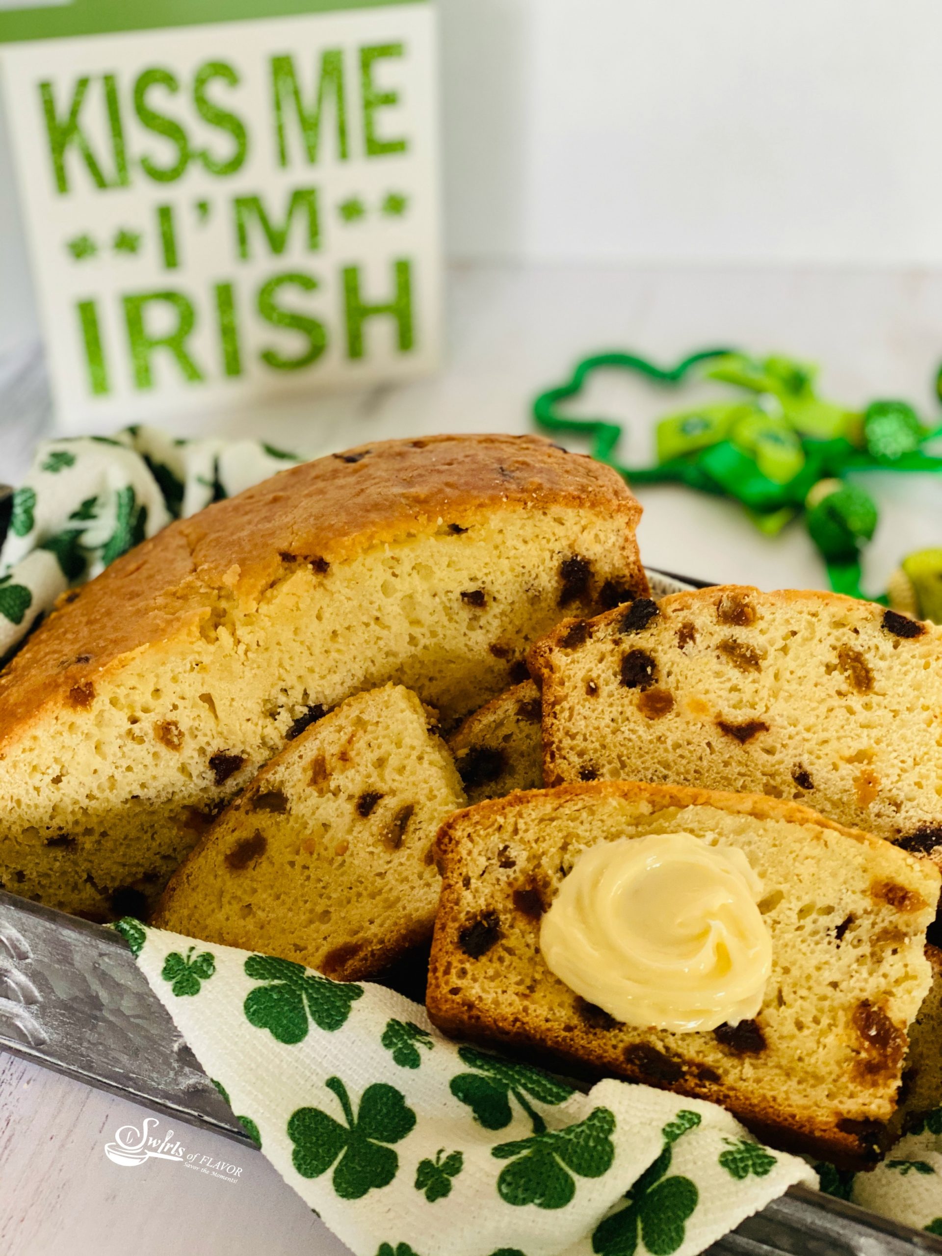 Best Irish Soda BreadRecipe in a basket with slices and butter
