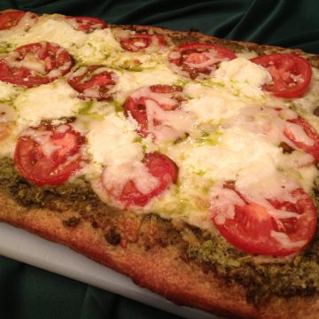Fontina Pesto Artisinal Pizza is an easy homemade pizza recipe. All it takes is refrigerated Artisan Pizza Crust, jarred pesto, plum tomatoes and cheeses and you’ll be just as gourmet as the best of them!