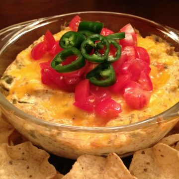 jalapeno popper dip in bowl with chips
