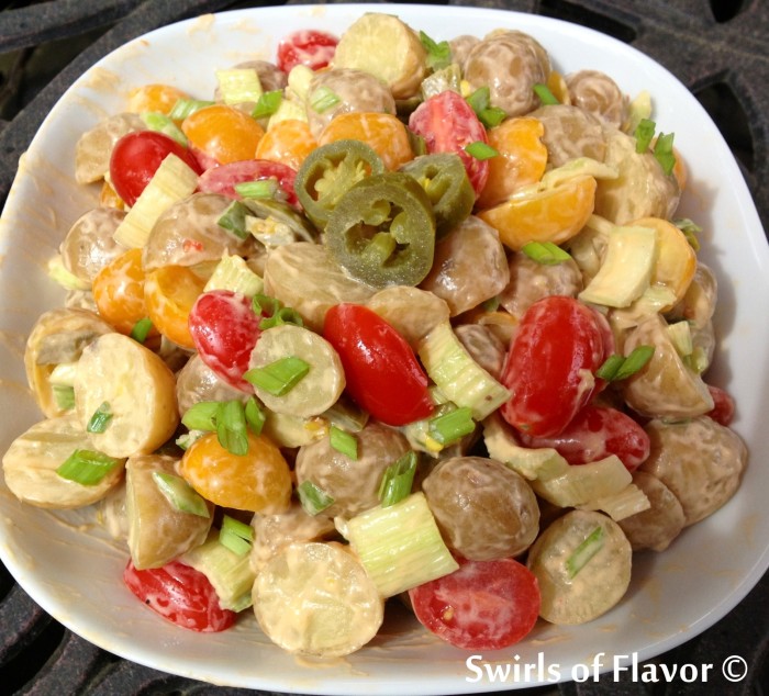 Kickin' Good Buffalo Ranch Potato Salad is an easy summer side dish recipe that gets it's creaminess from prepared salad dressing and crunch from celery and scallions. Add in pickled jalapenos for some extra crunch and heat!