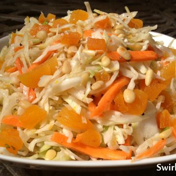 Orange Basil Cole Slaw is an easy recipe for a summer side diah. Just season your cole slaw mix with an orange and basil scented vinaigrette, stir in apricots and toasted pine nuts and you’ve got the perfect crunch, bursts of sweetness and nutty flavor in every mouthful!