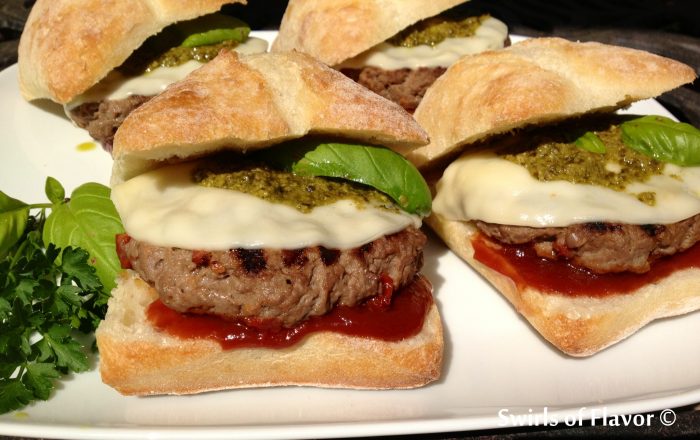 Pesto Provolone Burgers are seasoned with a zesty Italian flavoring mix and sundried tomatoes and topped with provolone, pesto and a homemade Balsamic ketchup! burgers | hamburgers | grilling | ground beef | Italian | provolone | pesto | barbecue