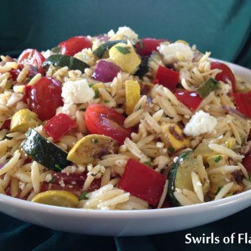 bowl of orzo with feta cheese and roasted vegetables