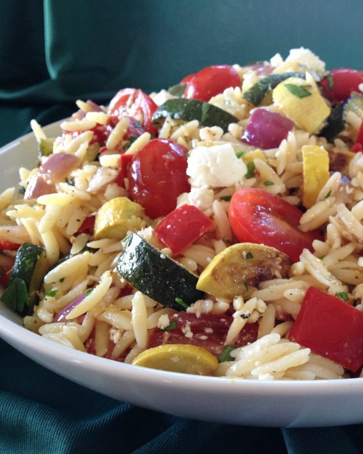 close up of orzo salad with feat