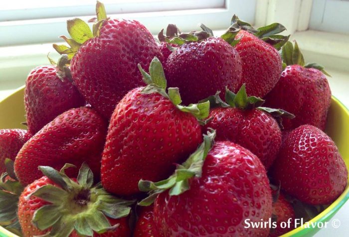 Strawberry Baby Greens Salad with Buttery Spiced Pecans has a hint of spice with a strawberry basil balsamic vinaigrette coating the delicate salad greens. 