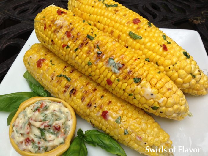 Grilled Corn With Tomato Basil Butter is an easy recipe for your summer get togethers and grilling corn gives the kernels a caramelized flavor that is lip-smackin’ good! easy recipe | farmers market | summer | corn on the cob | grilling | #swirlsofflavor