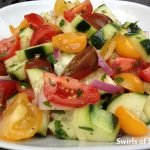 Heirloom Tomato & Cucumber Summer Salad is an easy summer side dish bursting with tomatoes and cucumbers lightly coated in a tangy red wine vinaigrette. Farmers market | vegetables | summer recipe | side dish | vinaigrette | easy recipe | #swirlsofflavor