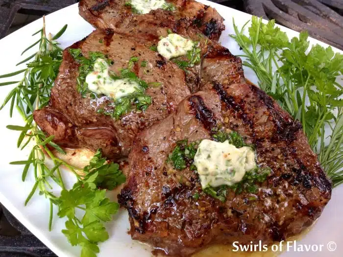 steak with flavored butter on top