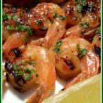 Grilled shrimp on skewers with lime and mint