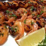 Mojito Shrimp is a twist on the classic rum cocktail.  An easy marinade of mint, rum and lime flavors the shrimp in just a few minutes. Grill or broil and you’ll have a fabulously delicious Cuban cocktail-inspired seafood dinner! #shrimp #grilling #grilledshrimp #seafood #dinner #easyrecipe #rummarinade #summer #swirlsofflavor
