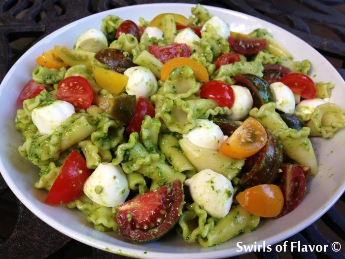 Make Pesto Florentine Campanelle Pasta and toss pasta with pesto, tomatoes, bocconcini and Parmesan, just 5 ingredients, for a bowl full of fresh summertime flavors! pasta | easy recipe| heirloom tomatoes | side dish | Meatless Monday | cheese | picnic | barbecue | homemade pesto | #swirlsofflavor