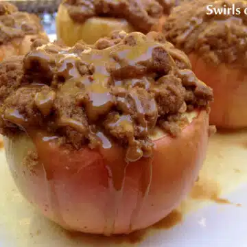 Baked apples with crumb topping and caramel drizzle