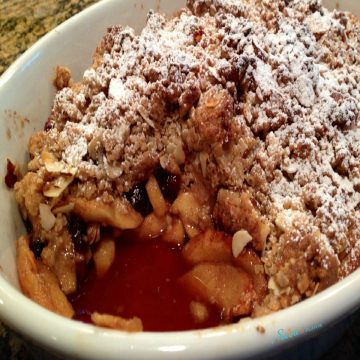 apple crisp with scoop out in baking dish