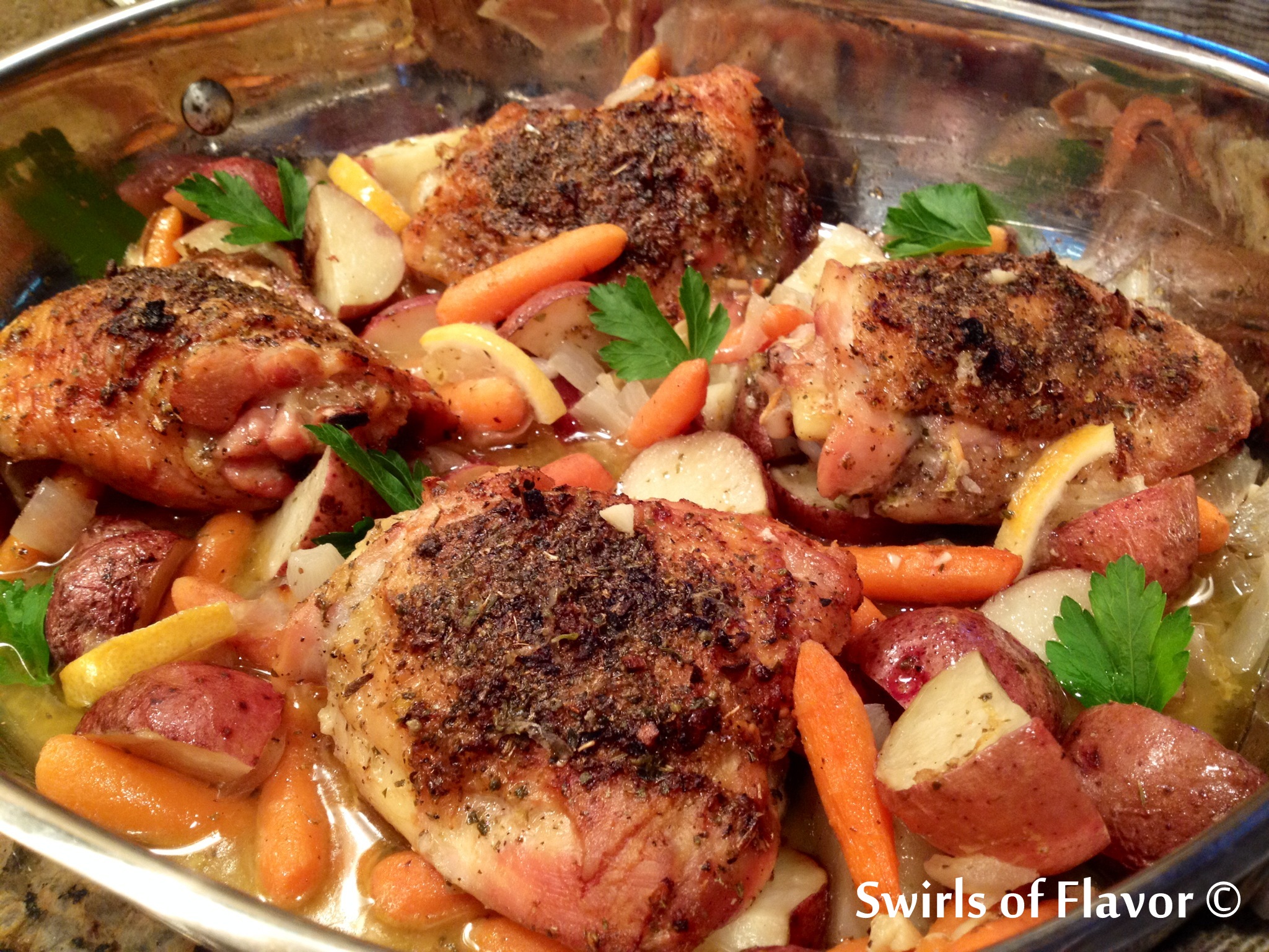 baked chicken and vegetables in baking pan