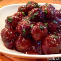 Cranberry Sweet & Sour Meatballs cook themselves in your slow cooker. Store bought frozen meatballs combine with two sauces, dried cranberries and Balsamic vinegar creating a homemade sweet and sour sauce that smothers the meatballs in deliciousness! #meatballs #sweetandsoursauce #slowcooker #crockpot #appetizer #easyrecipe #gameday #movienight #6ingredients #swirlsofflavor