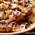 Cinnamon Bun Bread Pudding in baking dish with scoop out