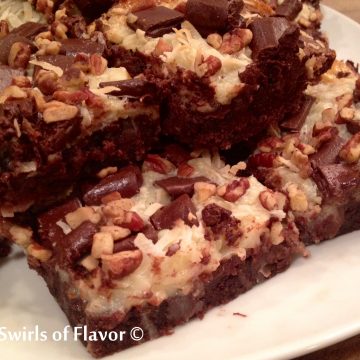 Magic Bar Brownies are intensely chocolate brownies from a mix topped with coconut, chocolate chunks and pecans that bake in a sweetened condensed milk layer. An easy dessert recipe for weeknight treats or entertaining! #swirlsofflavor | brownie mix | dessert | fun for kids | easy recipe