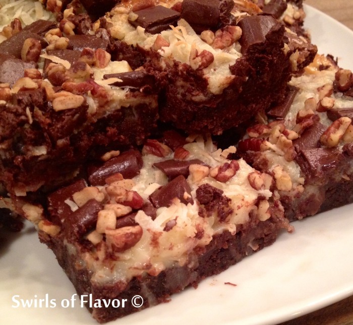 Magic Bar Brownies are intensely chocolate brownies from a mix topped with coconut, chocolate chunks and pecans that bake in a sweetened condensed milk layer. An easy dessert recipe for weeknight treats or entertaining! #swirlsofflavor | brownie mix | dessert | fun for kids | easy recipe 