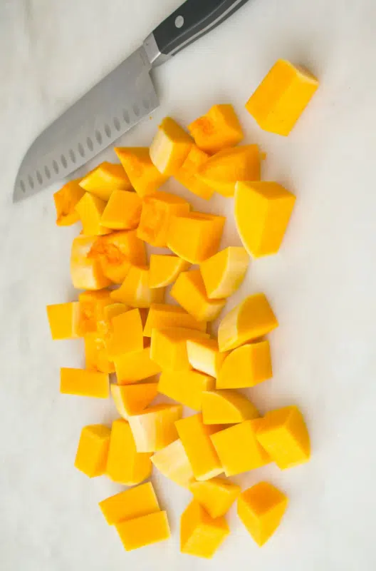 butternut squash cut up with chef knife