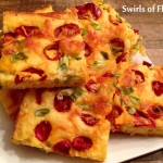 Cheesy Jalapeno Cornbread is as quick and easy to make as it is beautiful and yummy! Start with a corn muffin mix with a few stir-ins, top with jalapenos, scallions and cheese, pop in the oven and in minutes you’ll be ready to serve up a mighty fine cornbread!