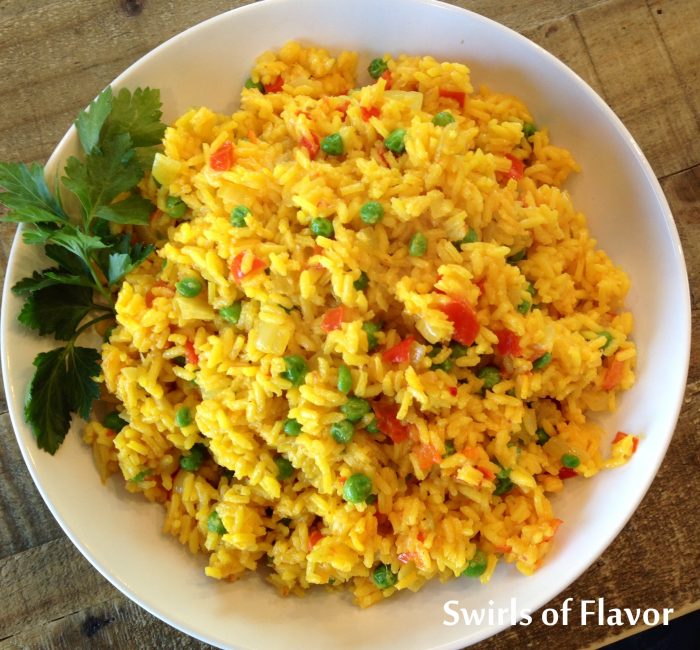 Fiesta Saffron Rice is an easy side dish that starts with a rice package that includes seasonings. Add fresh vegetables for a fiesta of flavors and colors! Perfect for Cinco de Mayo and quick and easy for a weeknight dinner.