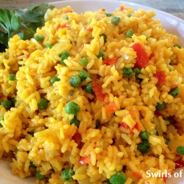 Fiesta Saffron Rice is an easy side dish that starts with a rice package that includes seasonings. Add fresh vegetables for a fiesta of flavors and colors! Perfect for Cinco de Mayo and quick and easy for a weeknight dinner.