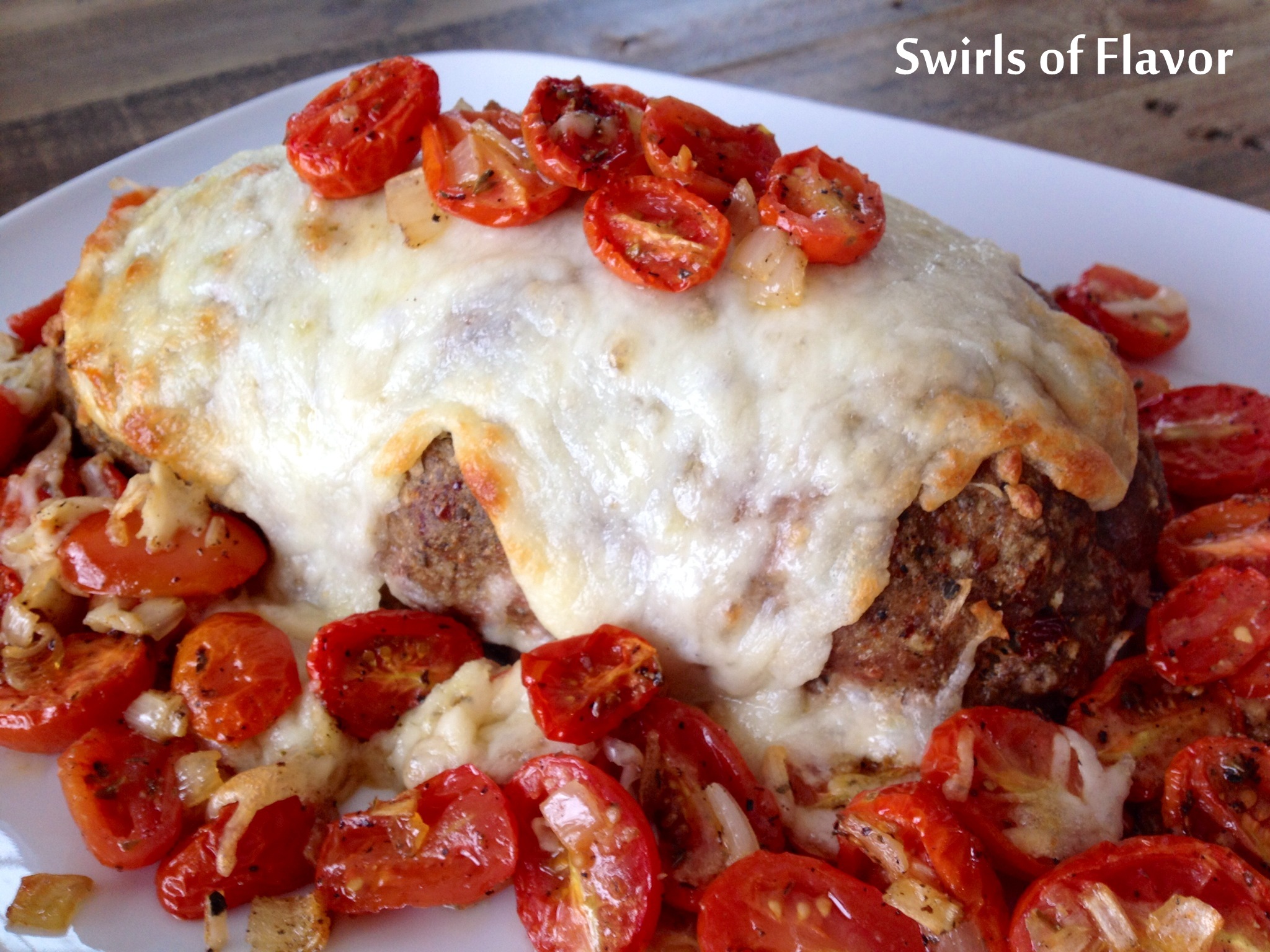 meatloaf parmesan with cheese and tomatoes