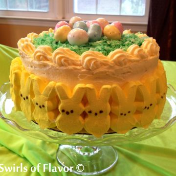 Bunny Peeps Lemon Layer Cake is a luscious lemon cake easily made from a mix, topped with a homemade creamy lemon frosting. The perfect Easter dessert and table centerpiece! Easter | dessert | cake mix | easy | recipe | peeps | candy Easter eggs
