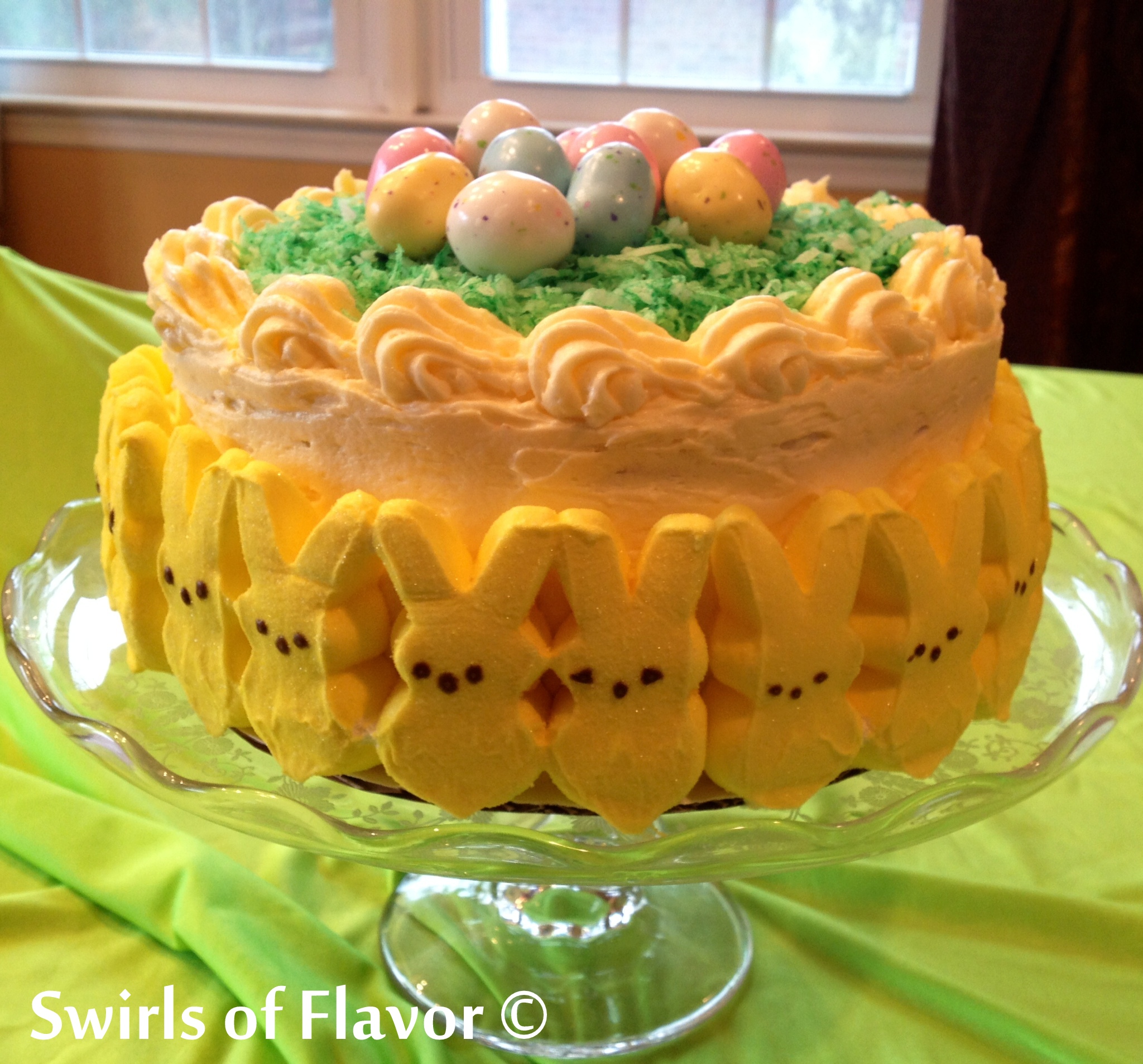 lemon layer cake with Easter decorations on a cake stand