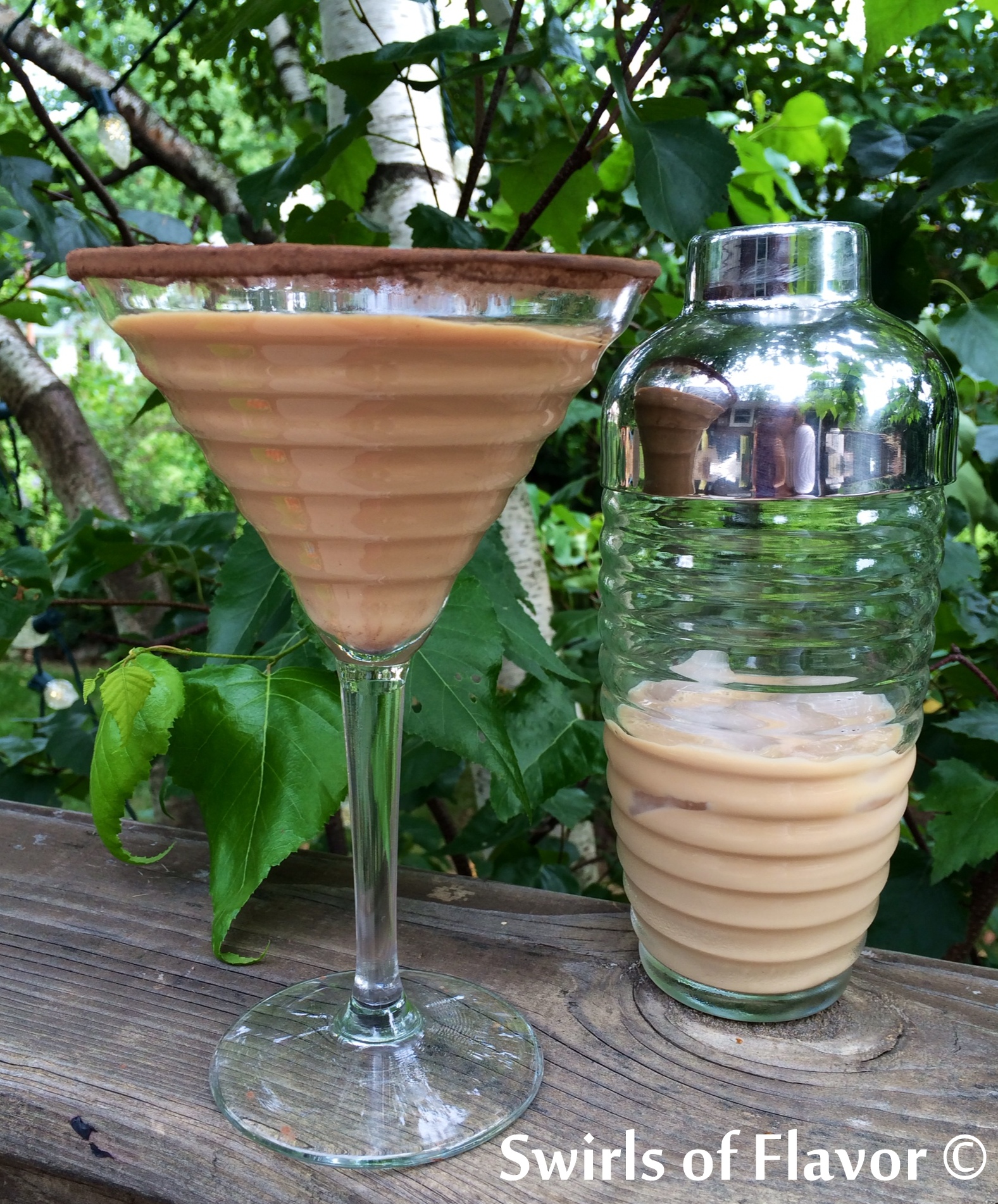 Chocolate Martini in glass with a cocktail shaker
