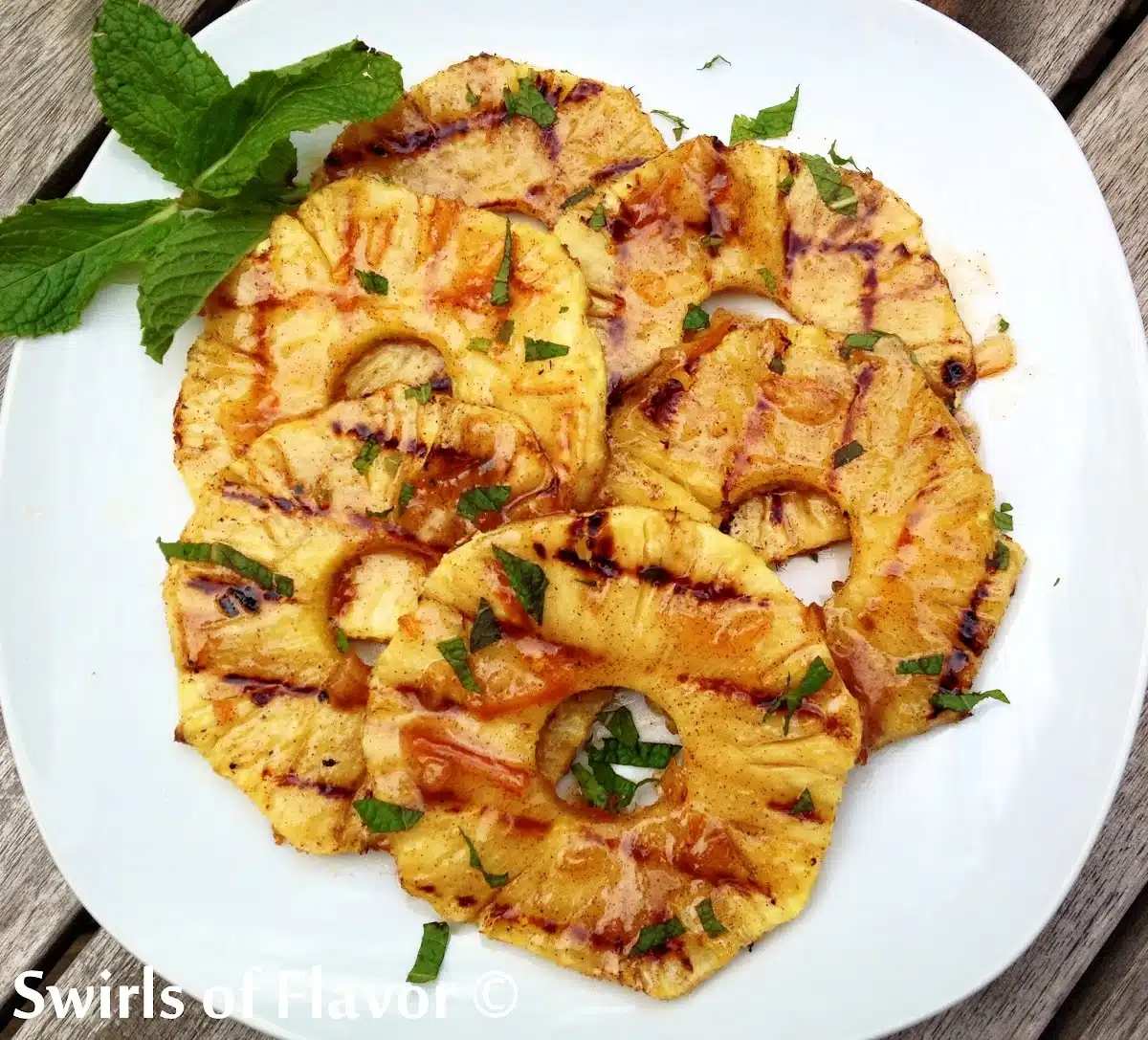 grilled pineapple slices on a plate