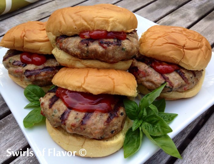 Tomato Basil Turkey Burgers are flavored with fresh basil, sundried tomatoes and mozzarella for a delicious and healthy alternative to ground beef! ground turkey | burgers | turkey burgers | healthy | barbecue | grilling | basil | cheese | sundried tomato | ground beef alternative