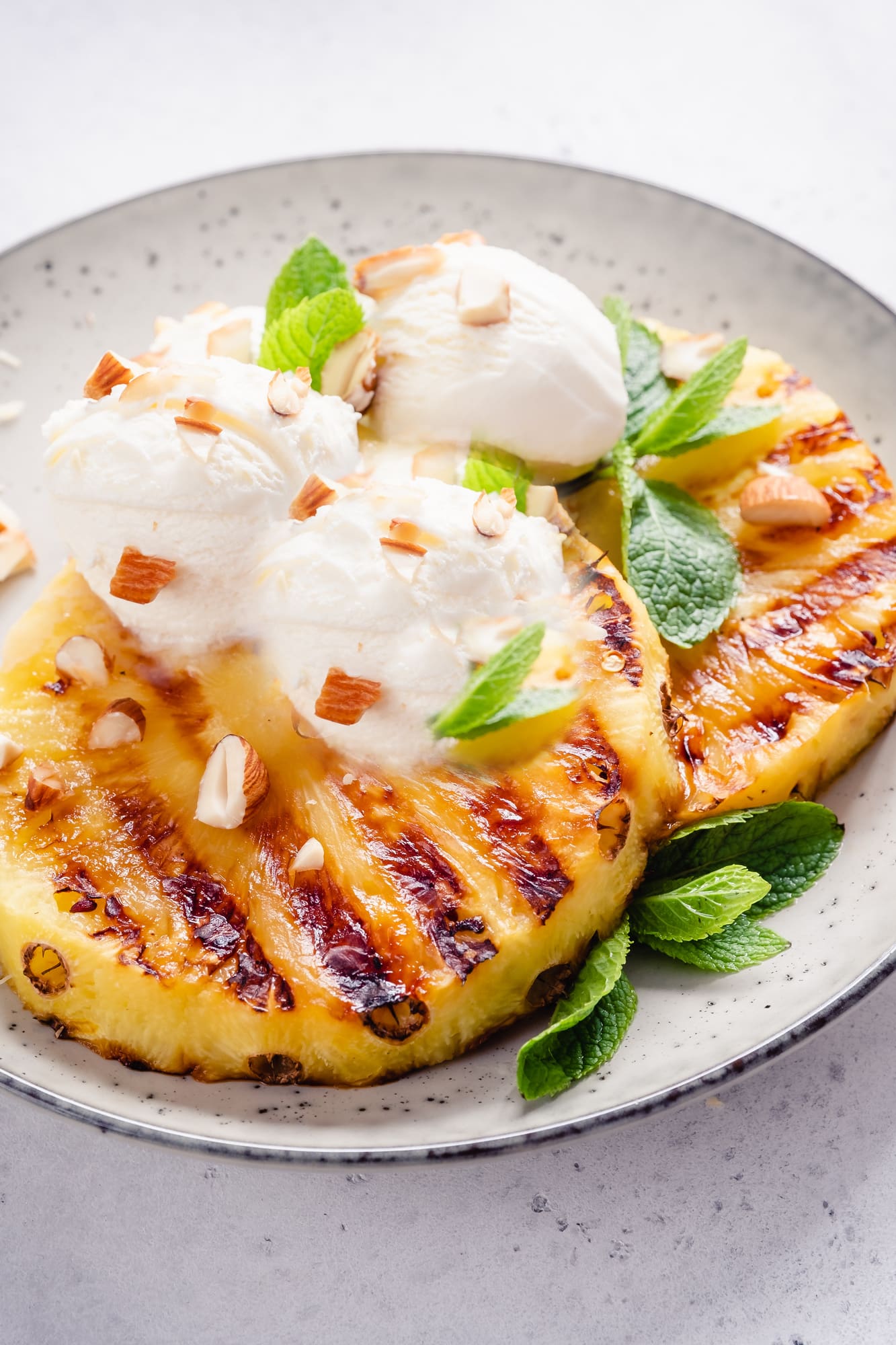 pineapple with scoops of ice cream