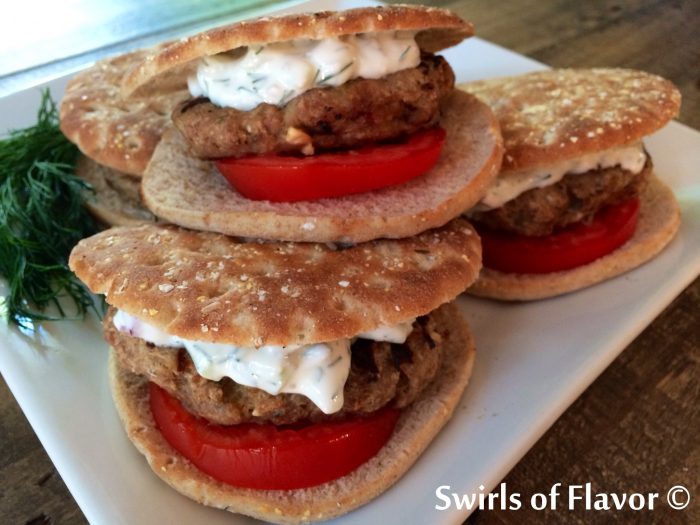 Greek Turkey Burgers with feta cheese, oregano and a pinch of red pepper flakes pair perfectly with the cool cucumber yogurt of the Tzatziki Sauce! turkey burger | Greek | cheese | feta cheese | yogurt sauce | cucumber | grilling