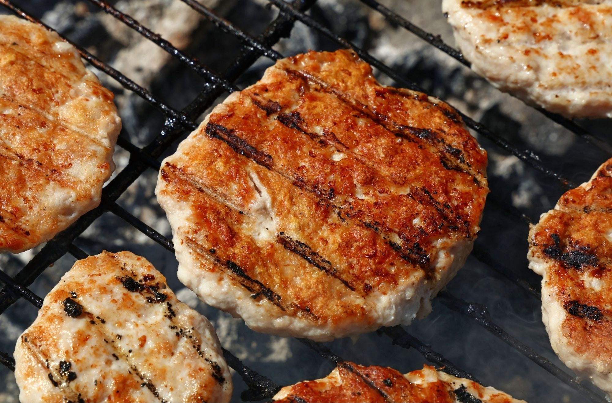 turkey burgers cooking on the grill