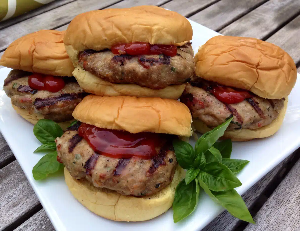 turkey burgers on buns with fresh basil