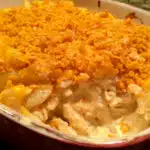 macaroni and cheese casserole with a scoop out