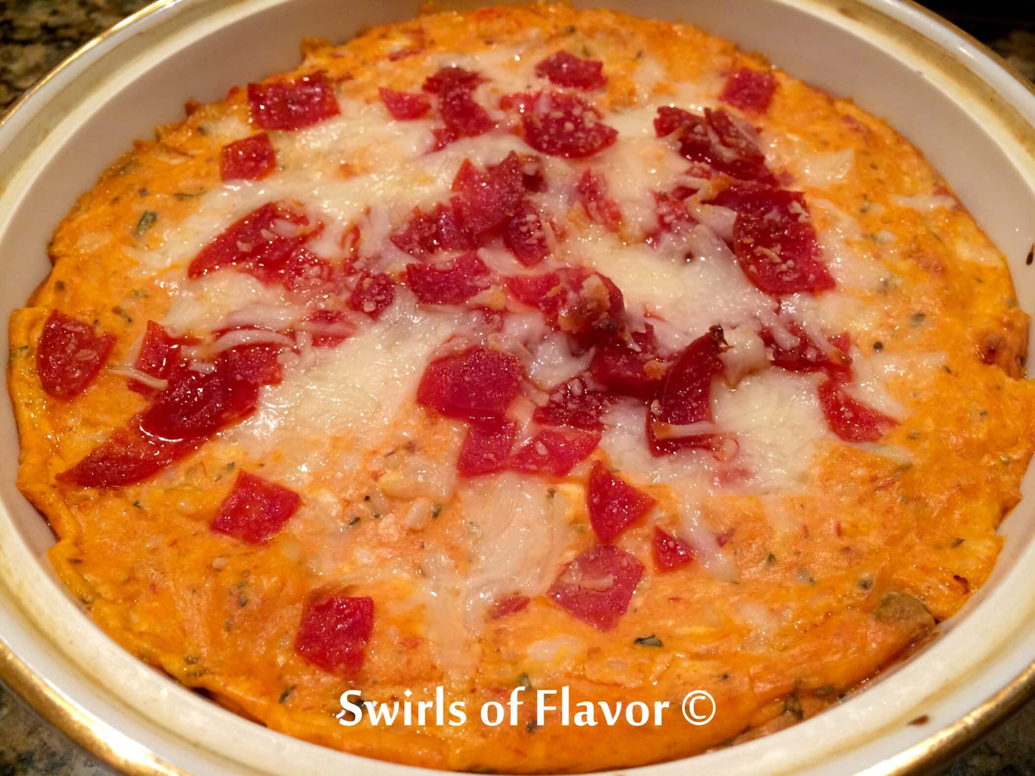 Pepperoni Pizza Dip is a cheesy pizza-flavored hot dip studded with bits of pepperoni. All the flavors of a pepperoni pizza baked in a creamy dip! Delicious when served with slices of crusty Italian bread.