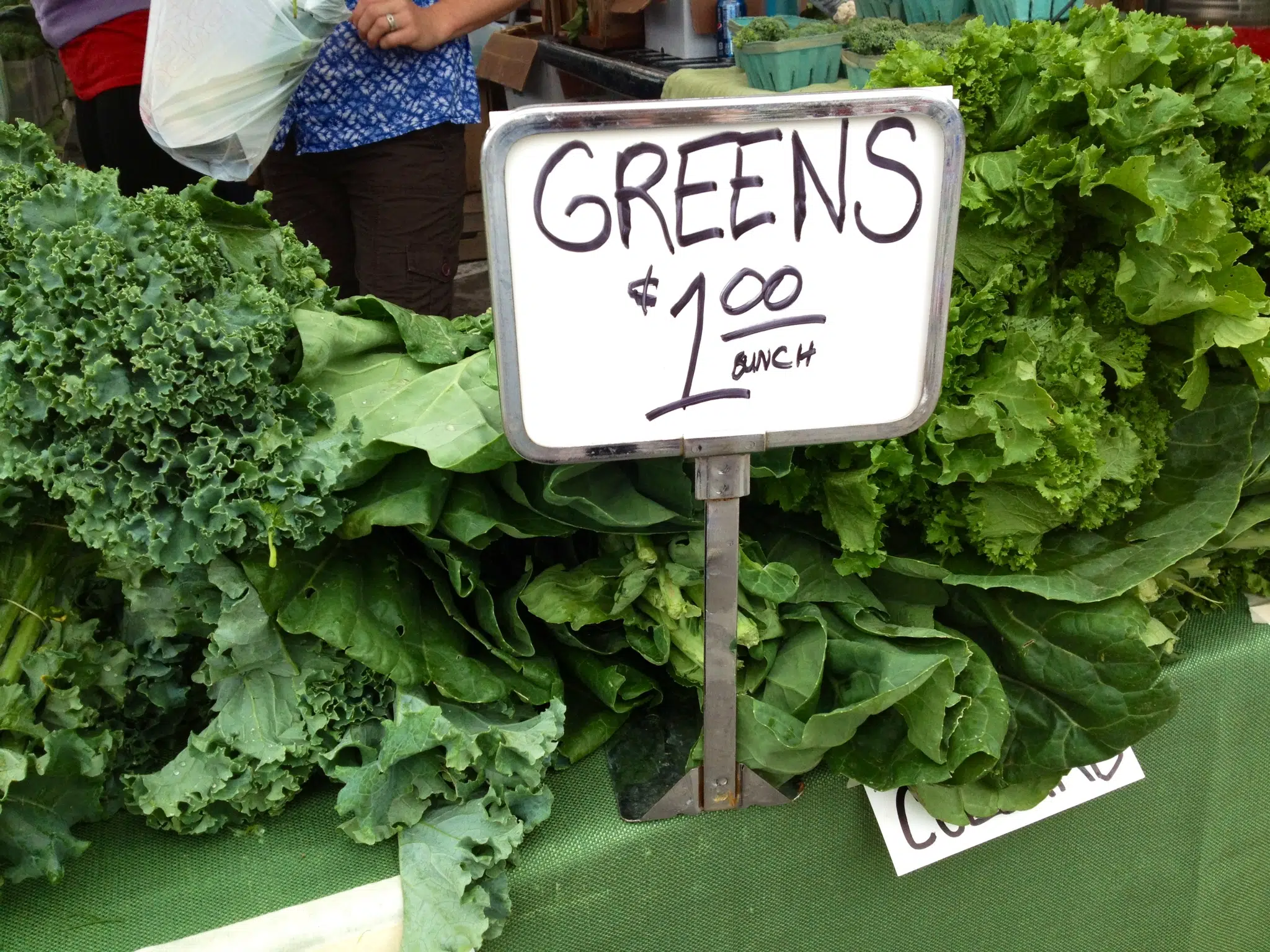 bunches of greens at farmers market