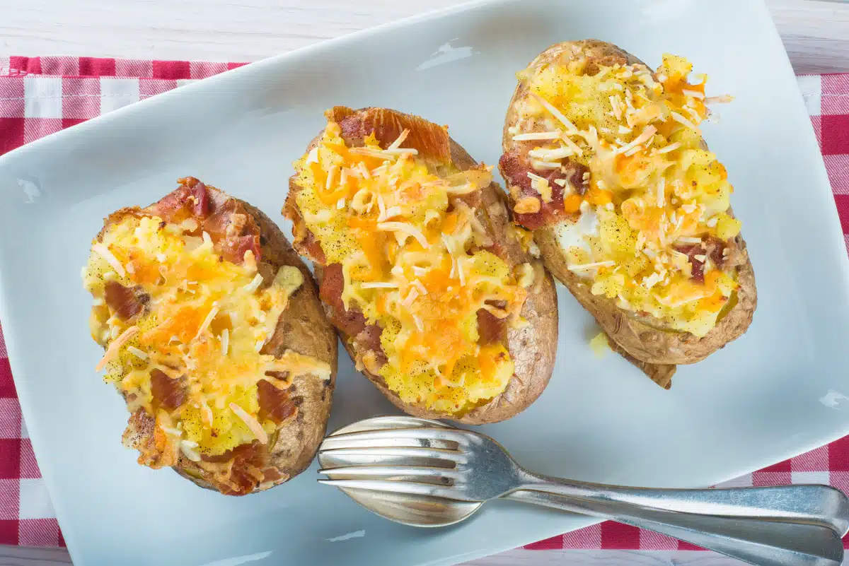 twice baked potatoes with bacon on a platter