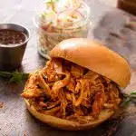 shredded buffalo chicken on a roll