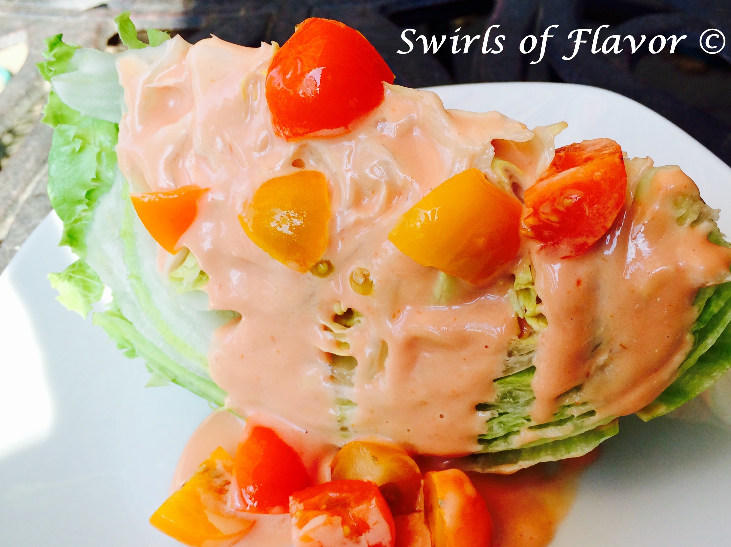 Iceberg Wedge Salad with creamy dressing and tomatoes