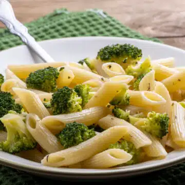 bowl of penne with broccoli