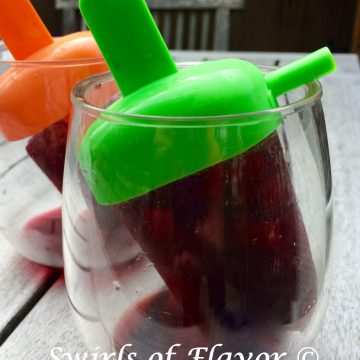 Pinot Noir, pomegranate juice and a fresh plum are all frozen to perfection in this easy recipe for Pomegranate Plum Wine Ice Pops! For the little kid in every grown up! #easyrecipe #frozen #icepop #wineicepop #dessert #frozendessert #summer #drinks #cocktail #PinotNoir #swirlsofflavor
