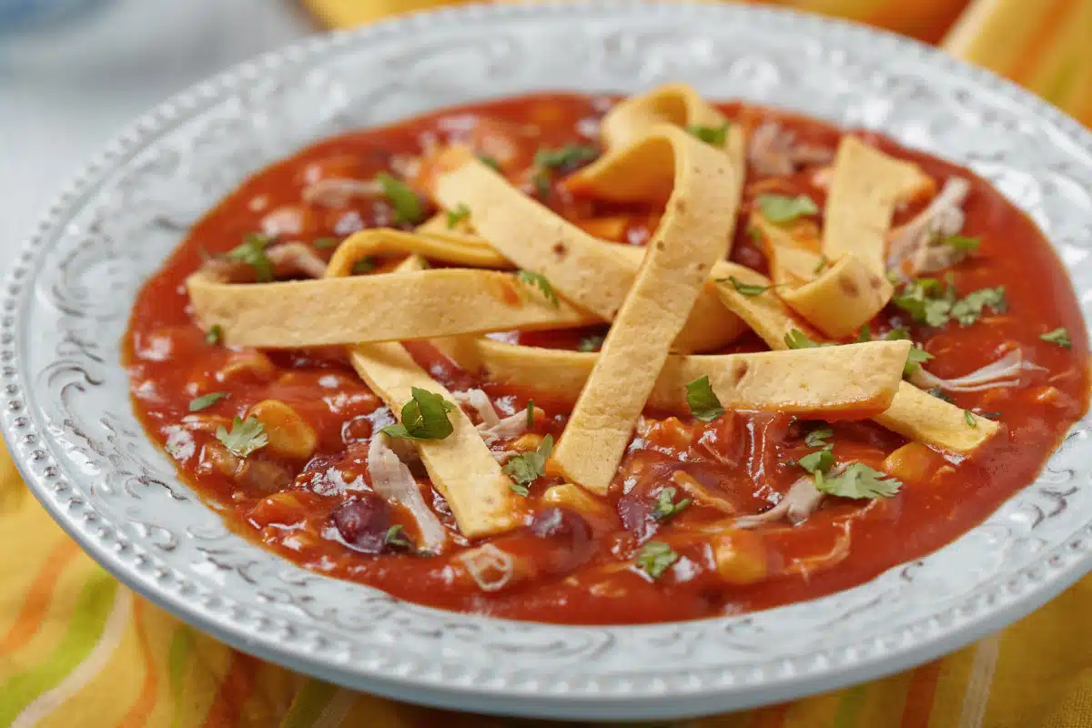 chicken tortilla soup in a white bowl