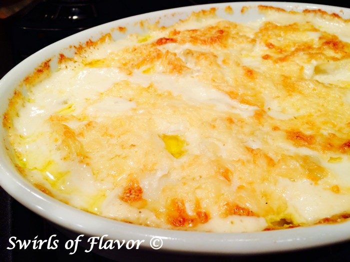 Slices of potatoes are gently boiled in a shallot cream mixture and then layered with cheeseÂ and baked to a cheesy, creamy perfection in ourÂ Golden Potatoes Au Gratin, recipe.