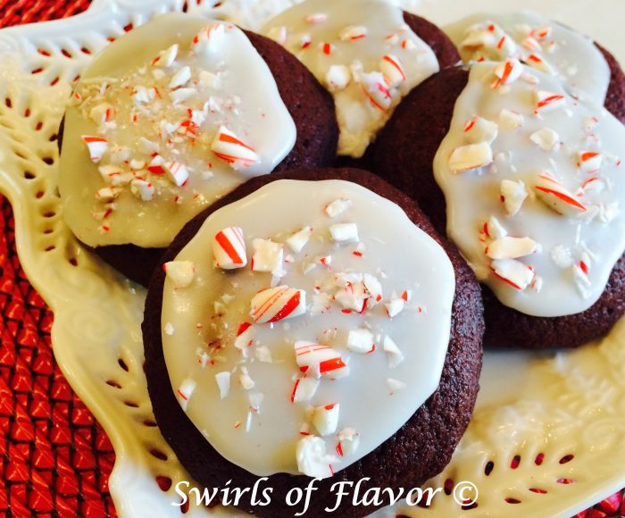 The ever popular red velvet cupcake has just become a cookie! Topped with a peppermint glaze and crushed candy canes and they become Peppermint Crunch Red Velvet Cookies!