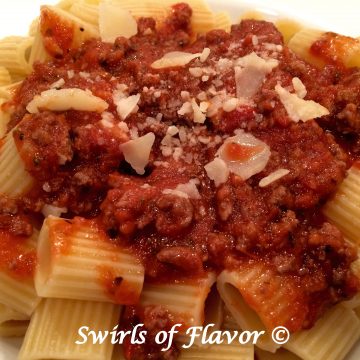 Best Ever Meat Sauce is a homemade pasta sauce that is ready in just 30 minutes and bursting with flavor. This easy meat sauce recipe is quick enough for a weeknight dinner and impressive enough for entertaining. #meatsauce #pastasauce #spaghettisauce #tomatosauce #gravy #pasta #easyrecipe #dinner #Italian #groundbeef #swirlsofflavor